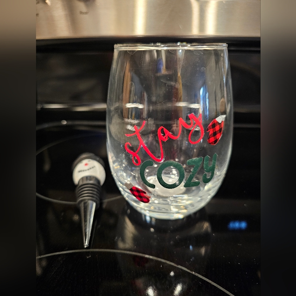 Stay cozy wine goblet w/snowman wine bottle stopper.